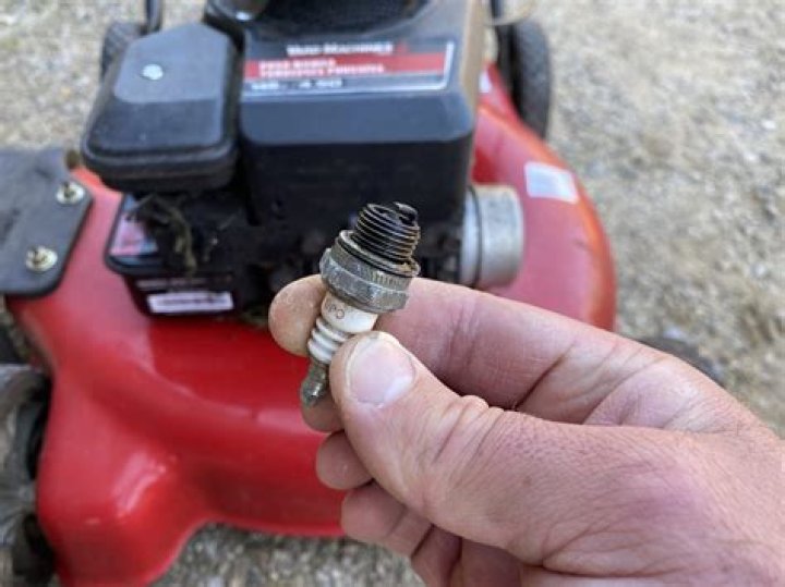 Where is the spark plug on Honda lawn mower